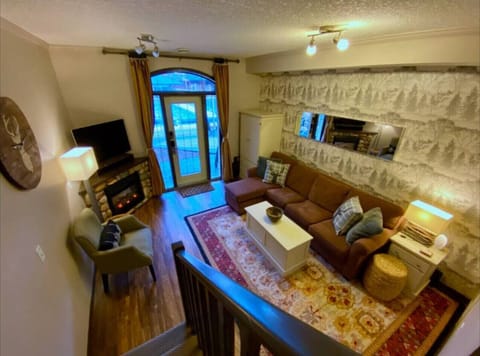 Relax by the fireplace with a view of the outdoors