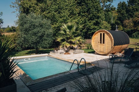 Seasonal outdoor pool, open 10:00 AM to 9:00 PM, pool umbrellas