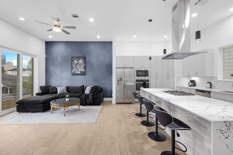 Spacious kitchen island w/ seating, great for quick bites or morning coffee.