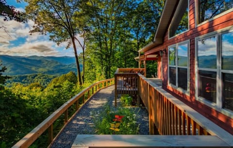 Expansive wraparound deck with long-range Smoky Mountain views at Dream Weaver cabin in Bryson City.