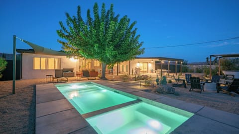 Glowing poolside oasis with desert views and inviting outdoor lounges