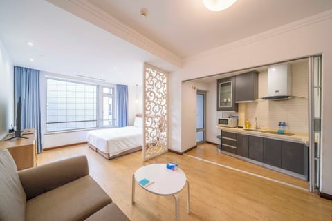 Superior Apartment, 1 Bedroom, Kitchen, City View | Living room | 55-inch Smart TV with cable channels