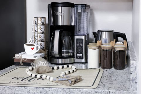Ninja coffee maker with ground coffee capabilities with complimentary coffee, decaf, tea, sugar, cream, and sweetener