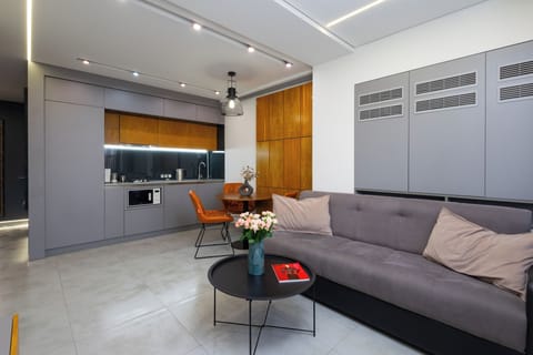 Superior Apartment, 1 Bedroom | Living area | 50-inch flat-screen TV with cable channels