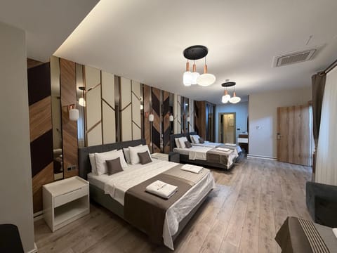 Family Quadruple Room, City View | In-room safe, desk, laptop workspace, WiFi (free)