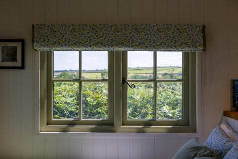 Rural views from the window by the bed