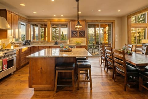 Fully equipped kitchen surrounded by windows. Tons of natural light and views.