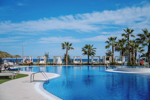 Outdoor pool, pool umbrellas, sun loungers