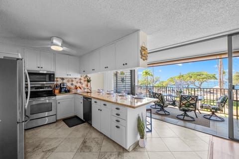 Cook with ease in a beautifully updated kitchen featuring stainless steel appliances, granite countertops, tile floors, and all the cookware you need.