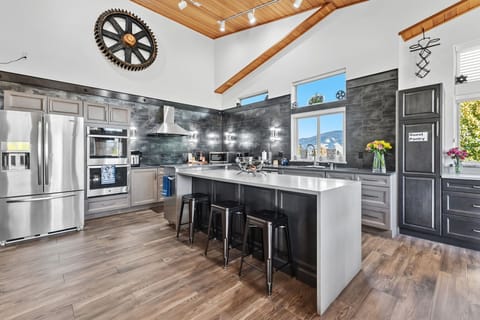 Kitchen: Main floor, drip coffee maker, Keurig, toaster, air fryer, cooking utensils, tableware