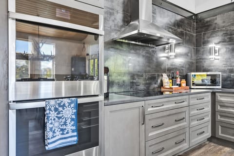 Kitchen: Main floor, drip coffee maker, Keurig, toaster, air fryer, cooking utensils, tableware