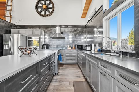 Kitchen: Main floor, drip coffee maker, Keurig, toaster, air fryer, cooking utensils, tableware