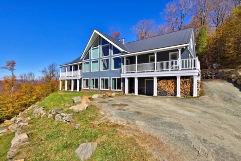 Arrive to a large Killington home set against a hillside of fall color.