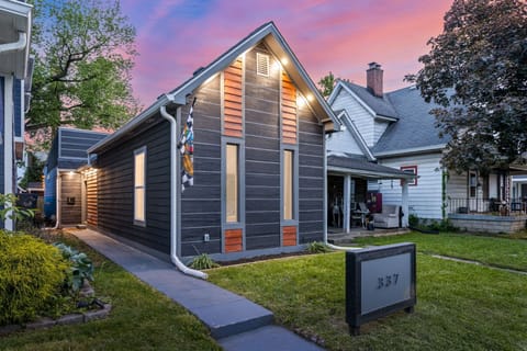 Striking modern design with dark siding and vibrant accents, perfect for photo ops!