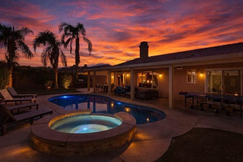 Outdoor Pool Area. Some exterior lighting shown in this image may not be present or turned on during your stay.