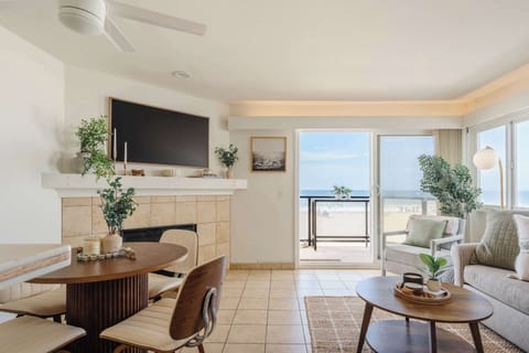 Bright and breezy oceanfront living room with panoramic Pacific views.