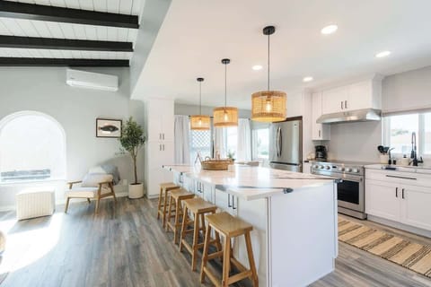Make this charming Bay Park retreat your next home away from home