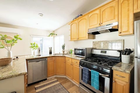 The sunny wrap-around kitchen comes fully equipped with everything you need