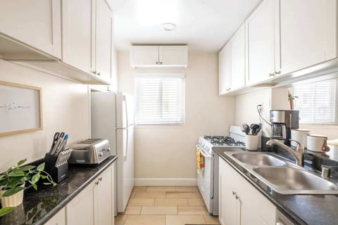 The chic little kitchen comes fully equipped with everything you need