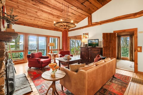 Cozy living area with rich wood tones and classic mountain cabin charm.