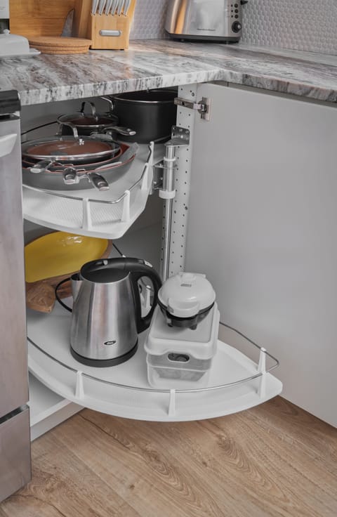 Pull-out corner storage for cooking essentials.