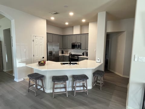 Spacious kitchen with new appliances and gas range 5 burner stove