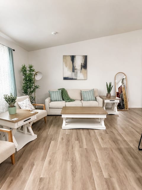 Step inside this bright, cozy living space, where plush seating invites connection and relaxation after a Tallahassee day.