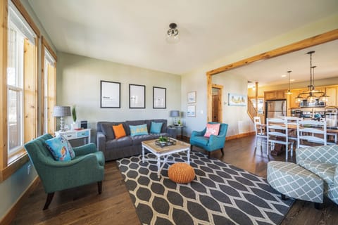 Open floor plan connects the living room, dining room, and kitchen.