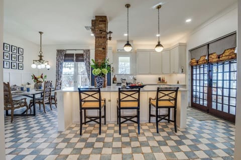 Charming dining space with vintage-style seating and stunning natural light—perfect for relaxed breakfasts or elegant evening meals.