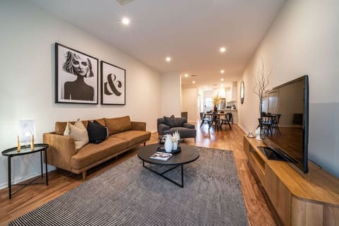 The open-plan layout flows effortlessly from the lounge to the dining and kitchen spaces, creating an easy setting for shared meals, relaxed entertaining, and comfortable everyday living.