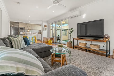 Settle into the generous chaise sofa and unwind with a movie, while the open layout keeps the kitchen and dining space connected for easy time together.