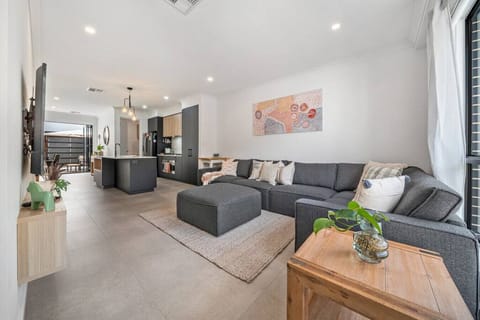 Sink into the soft sectional and enjoy movie nights or quiet downtime in the open-plan living area.