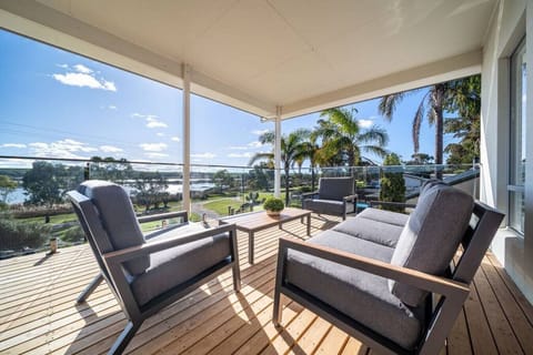 Unwind on the balcony lounge seating while taking in uninterrupted river views.