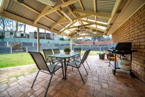 Enjoy relaxed outdoor dining beneath the covered entertaining area, with plenty of space for alfresco meals, afternoon drinks, and time spent outdoors.