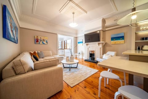 Relax in the comfortable living area, where warm timber floors and soft furnishings create an easy place to unwind after a day out.