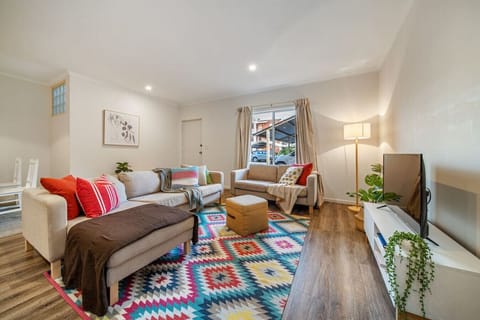 Unwind in the living room, stretching out on the sofa with a movie after a day in the city.