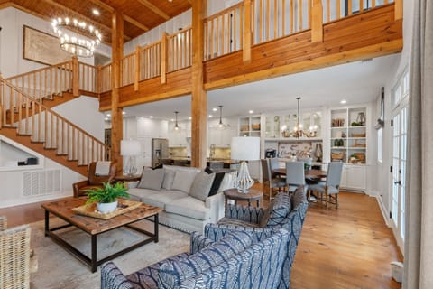 Enjoy an open living area with a fully equipped kitchen, perfect for cooking, dining, and relaxing together while taking in lake views.