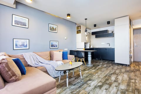 Comfort Apartment | Living area | 50-inch flat-screen TV with cable channels