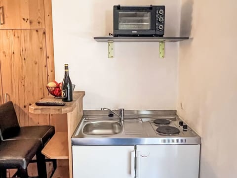 Wood, Furniture, Flooring, Floor, Interior Design, Room, Sink, Cabinetry, Major Appliance, Plumbing Fixture