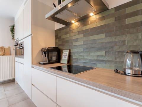 Flooring, Interior Design, Kitchen, Countertop, Floor, Furniture, Cabinetry, Home, Ceiling, Tile