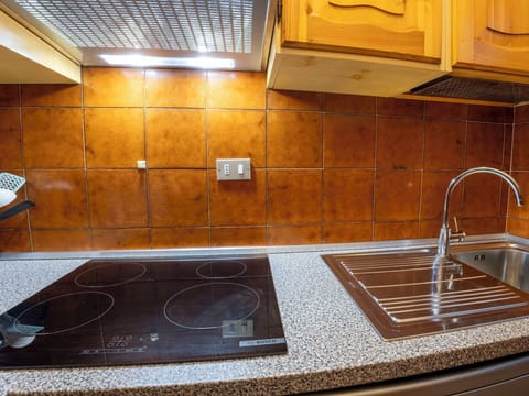 Kitchen, Countertop, Major Appliance, Kitchen Appliance, Flooring, Kitchen Sink, Kitchen Stove, Floor, Interior Design, Stove