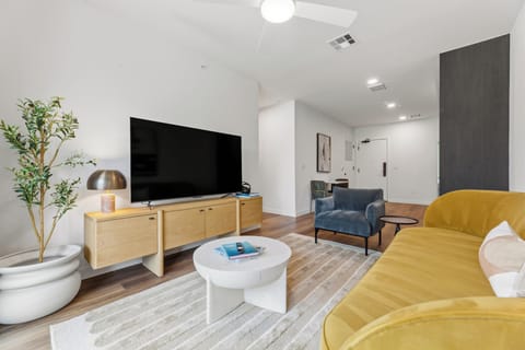 Stretch out in the inviting living room with a pull-out sofa, oversized TV, and modern design touches throughout.