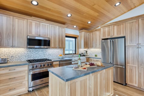 Stunning kitchen with natural wood and modern appliances.