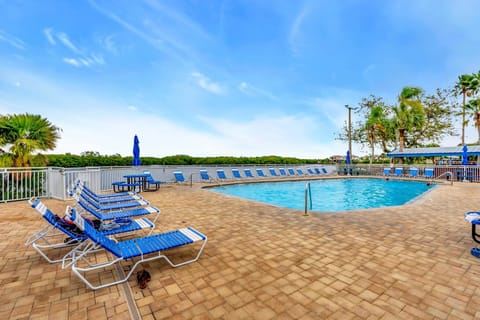 Soak up the sun by the pool in a serene, tropical setting. Plenty of lounge chairs and peaceful views make it the perfect spot to unwind.