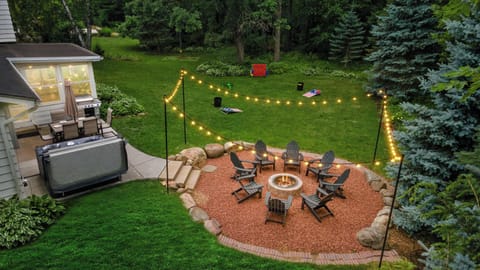 The property is on a dead end corner lot and has a private feel to it. We have yard games, a fire pit that seats 10, hot tub, dining table, and a walking path connected to the playground across the street.