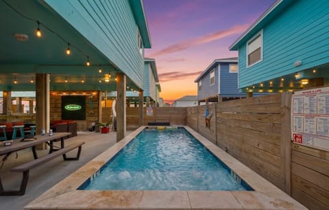 Private Pool at Sunset — Lap Pool, String Lights, Neon Signs & Covered Lounge