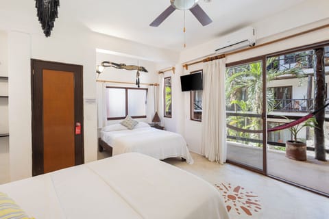 Traditional Quadruple Room, 2 Double Beds, Pool View | In-room safe, individually decorated, individually furnished