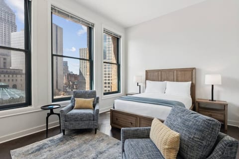 Breathe in skyline light and relax in this cozy suite.