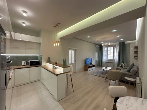 Family Apartment | Living area | 50-inch flat-screen TV with cable channels