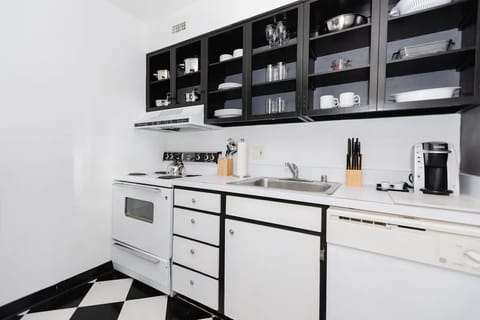 Cook with ease in the bright kitchen stocked for quick meals.